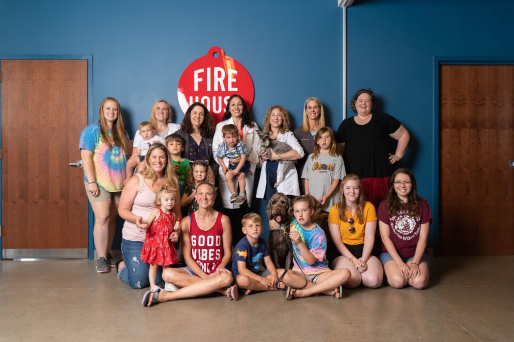Firehouse Animal Health Center - group picture of women, kids and pets