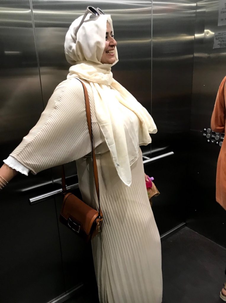 Farhana Khawar - woman wearing white hijab in elevator