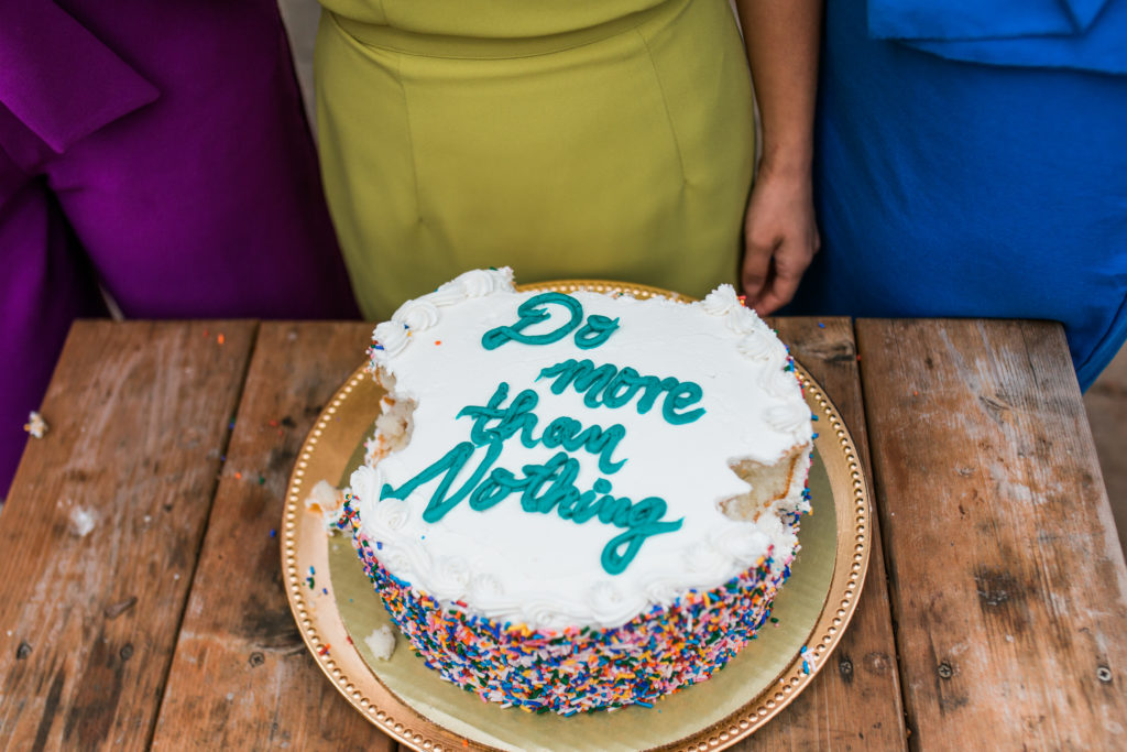cake with 'do more than nothing' written in icing