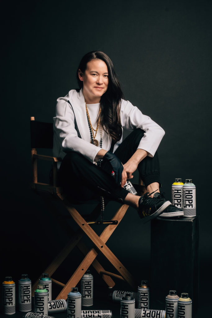 Andi Scull sitting in director chair - Austin Woman Magazine - by Daniel Nguyen