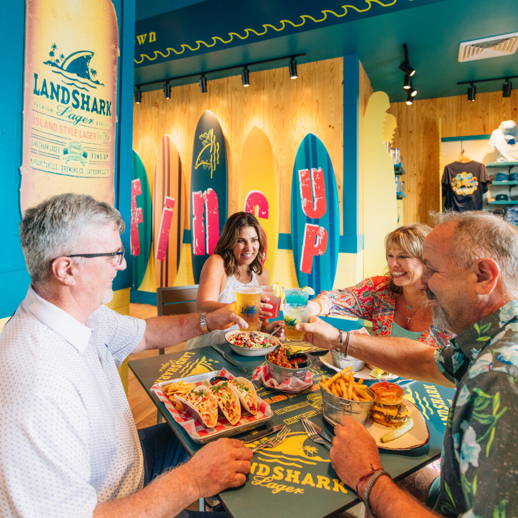 A group of friends enjoying their beers at Margaritaville Resort at Lake Conroe in Texas