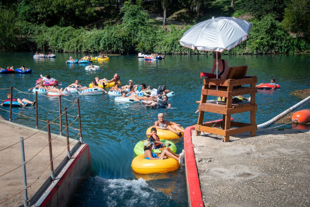 People floating the Comal River in New Braunfels, Texas