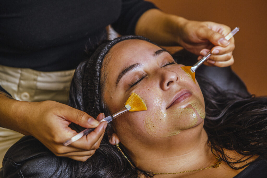 Woman at eleMINT Skin Health & Wellness Studio getting facial treatment