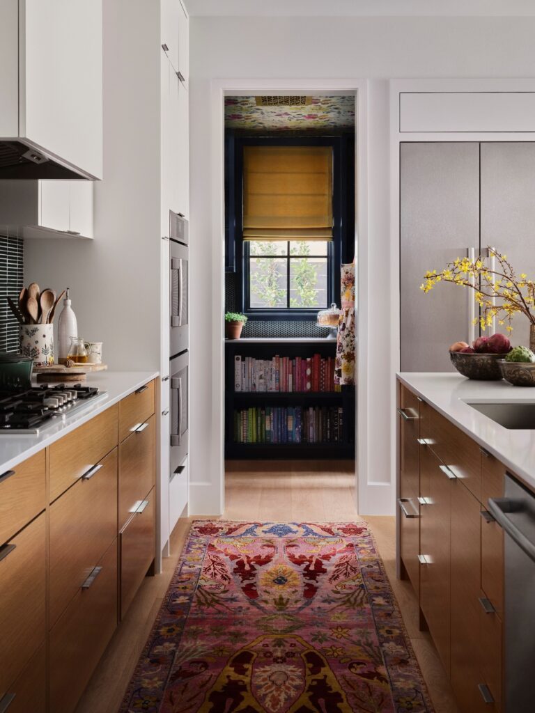 Luxe kitchen with beautiful runway rug between two counters